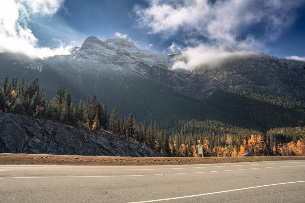 a road with a mountain in the background