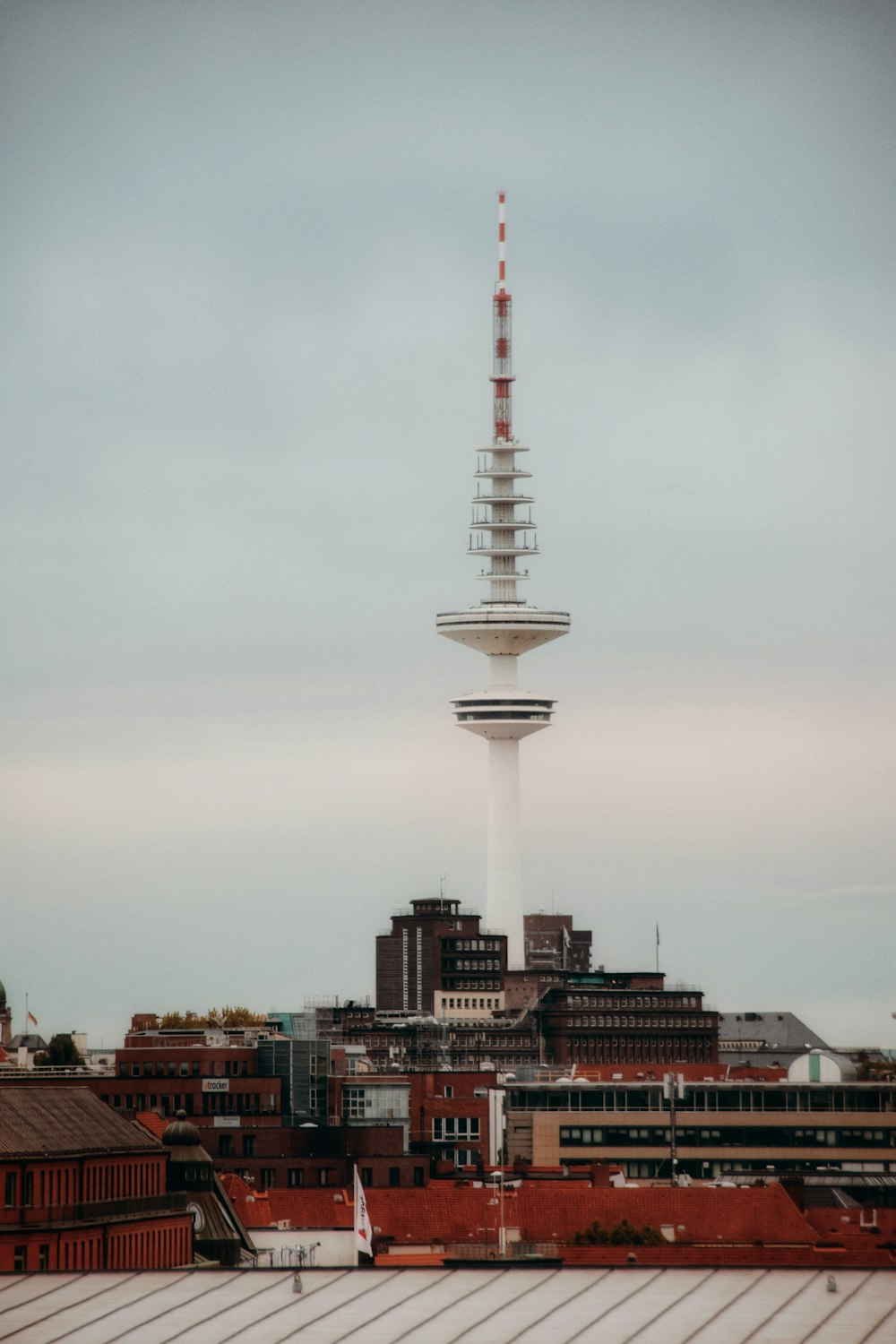 a very tall building with a very tall tower in the background