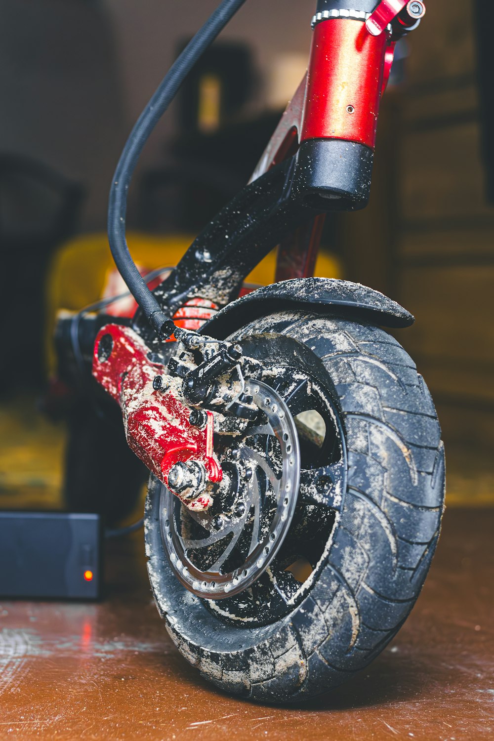 a close up of a red and black motorcycle tire