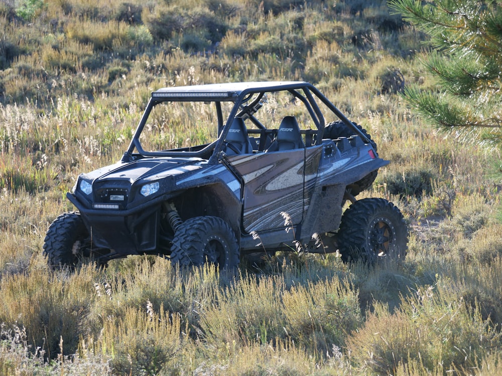 a can - am commander off - roading through a field