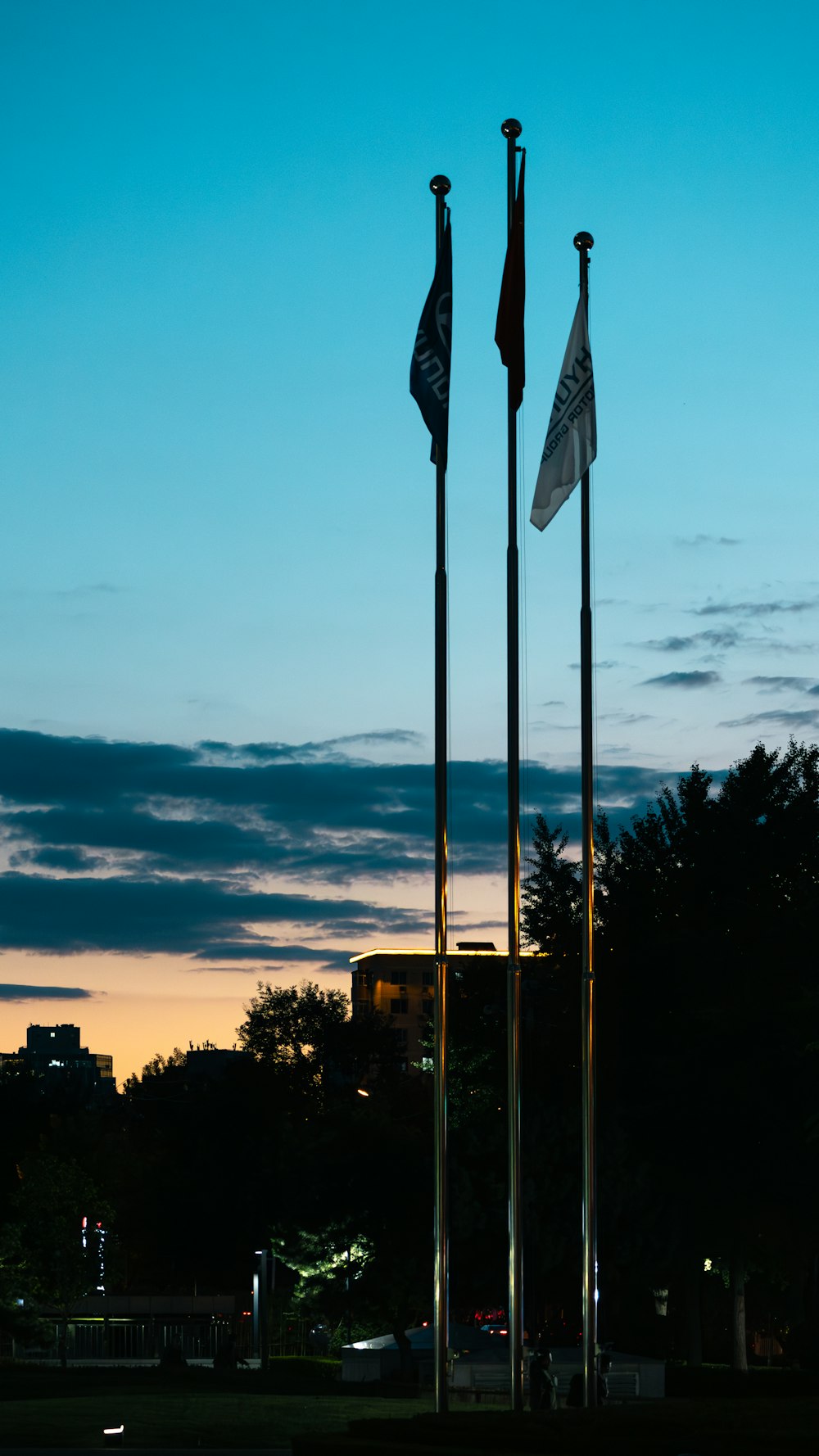 a couple of flags that are next to each other