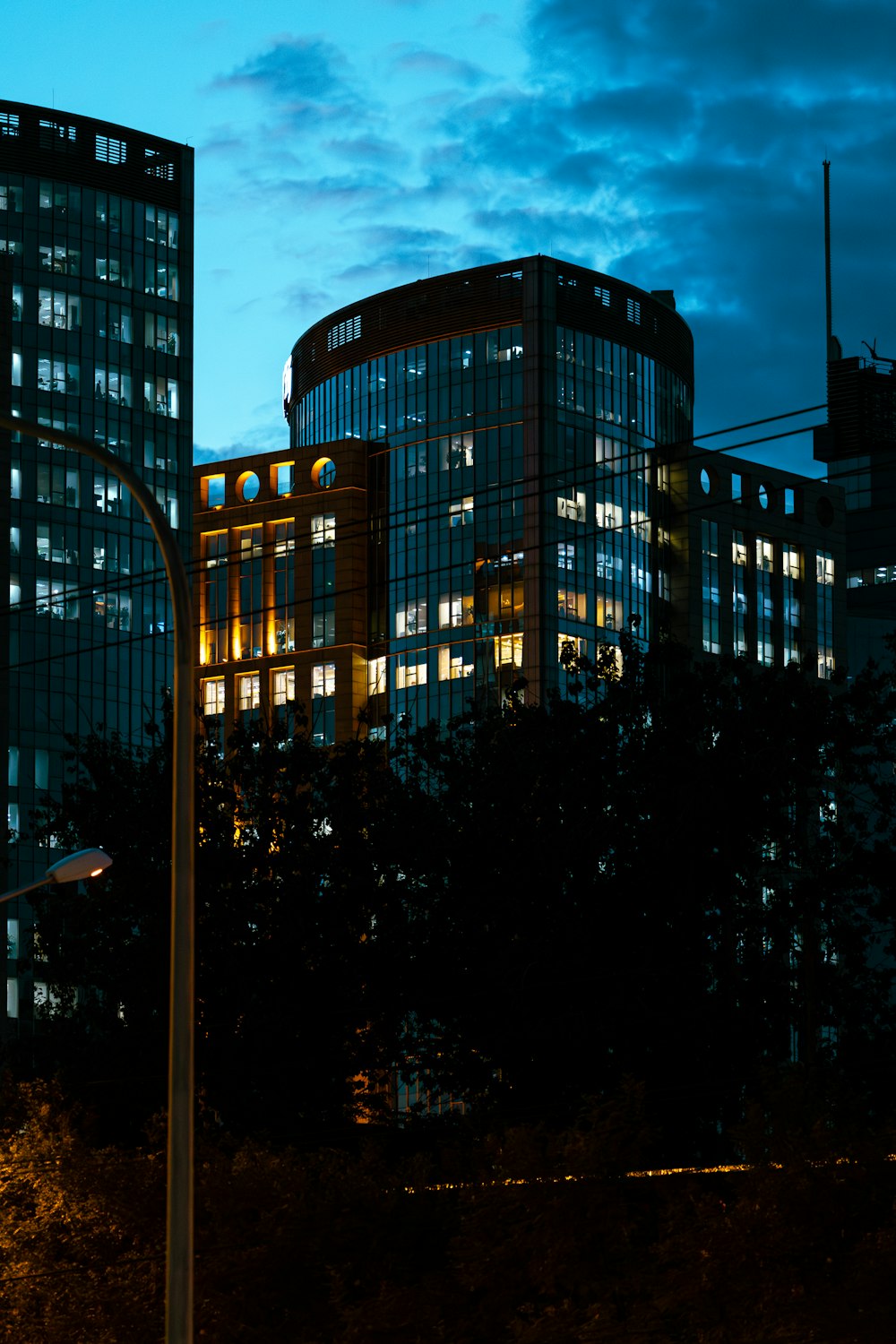 a street light with a building in the background