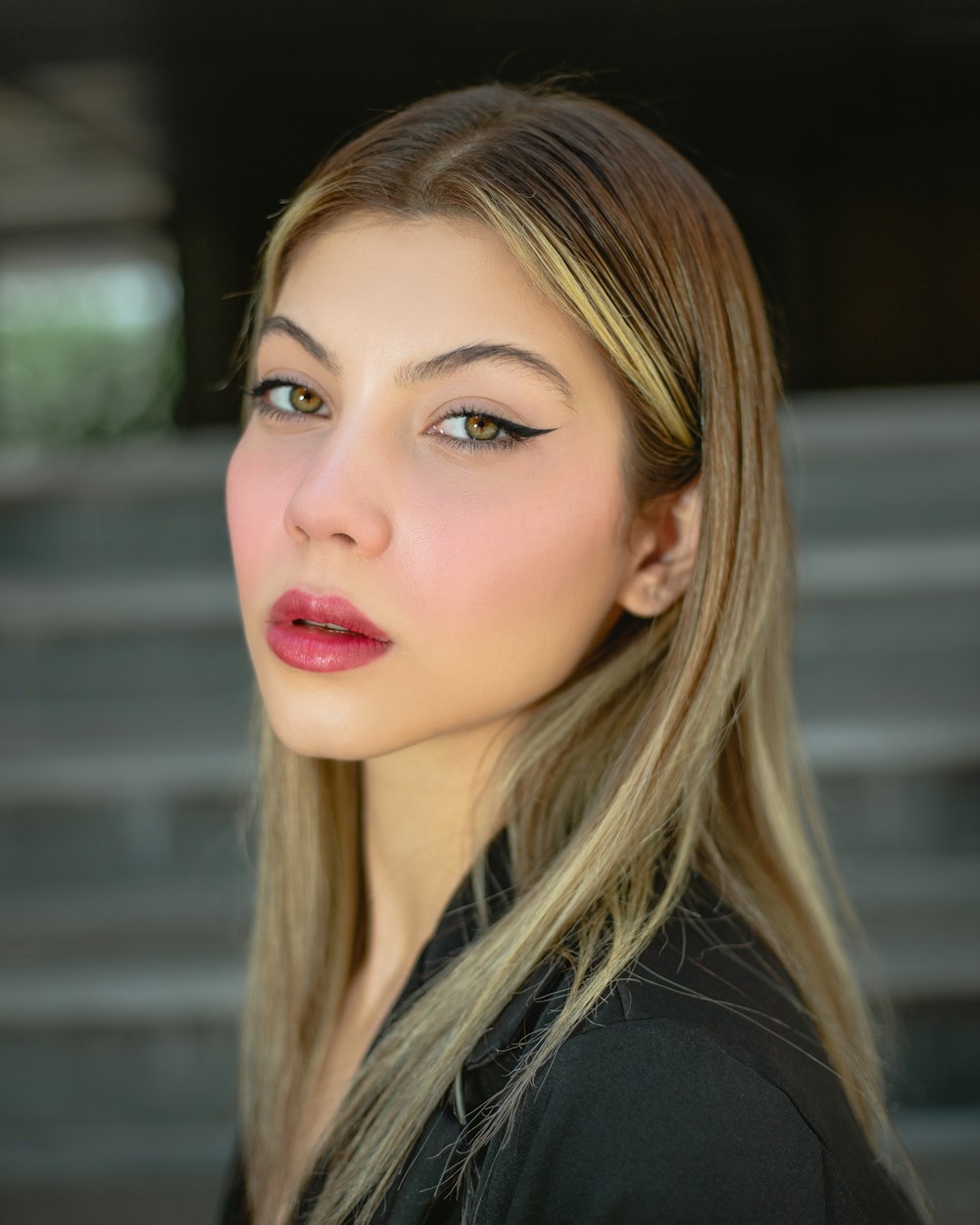 a woman with long blonde hair and blue eyes