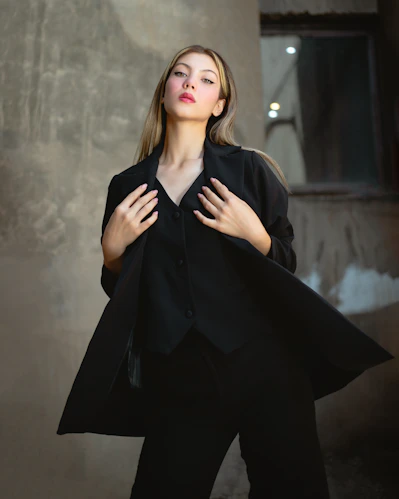 a woman with her hands on her chest