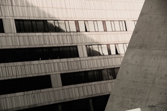 Architectural detail of a curved concrete facade with shadows