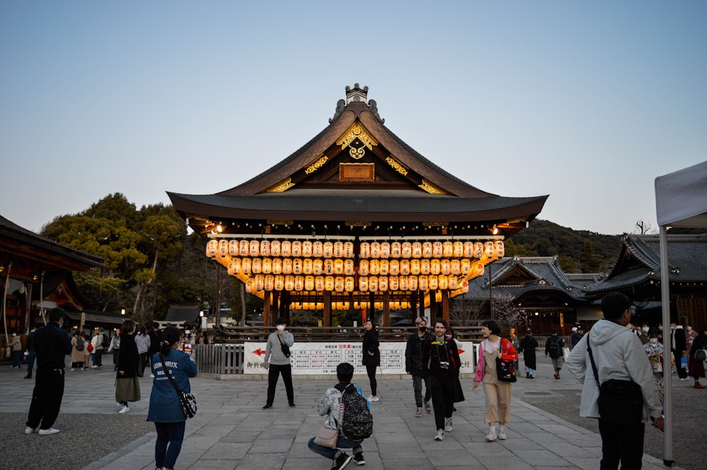 a group of people standing in front of a building