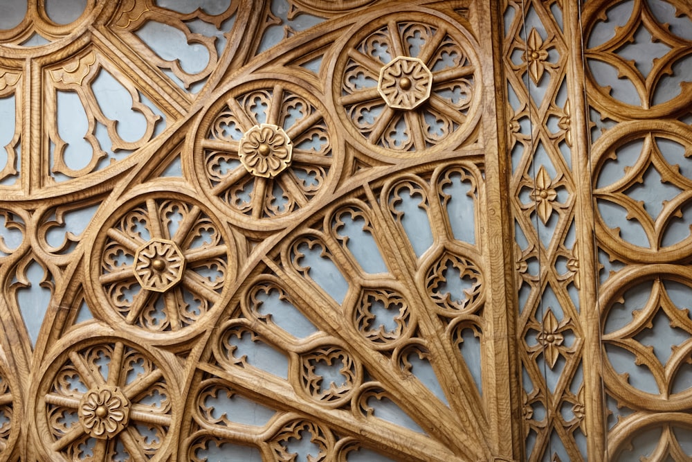 a close up of a wooden carving on a wall