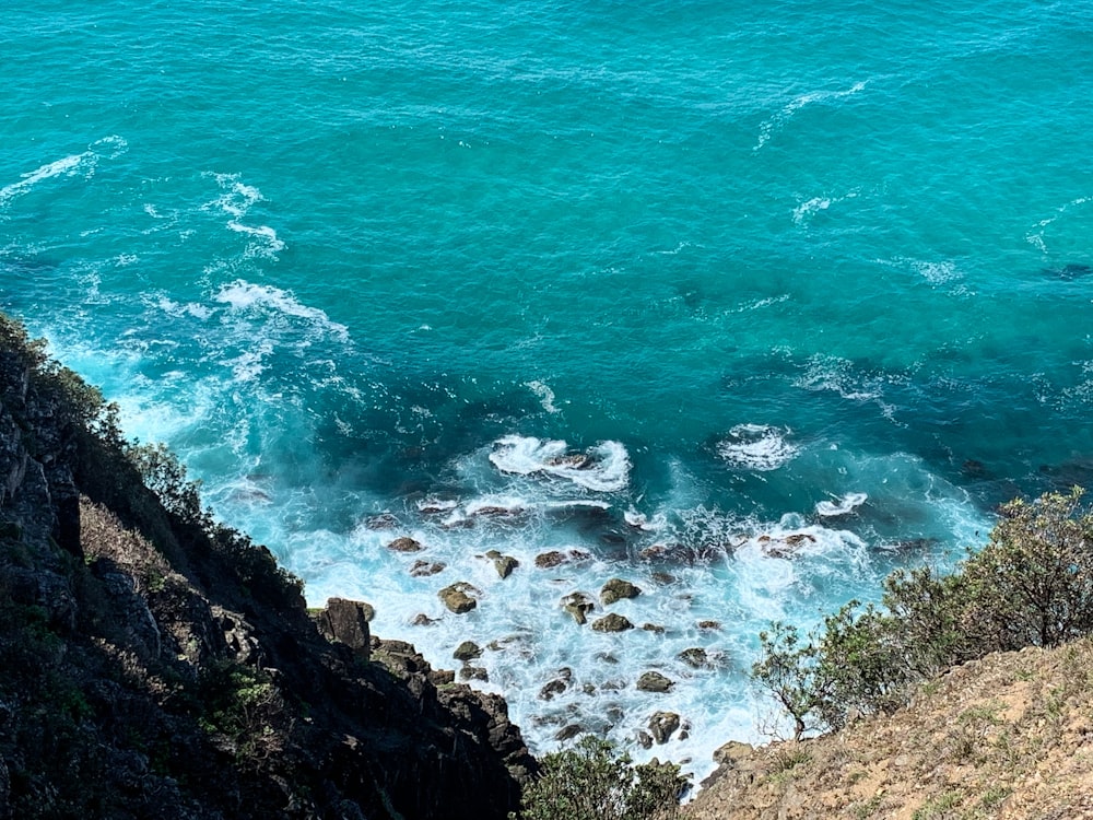 a view of the ocean from the top of a hill