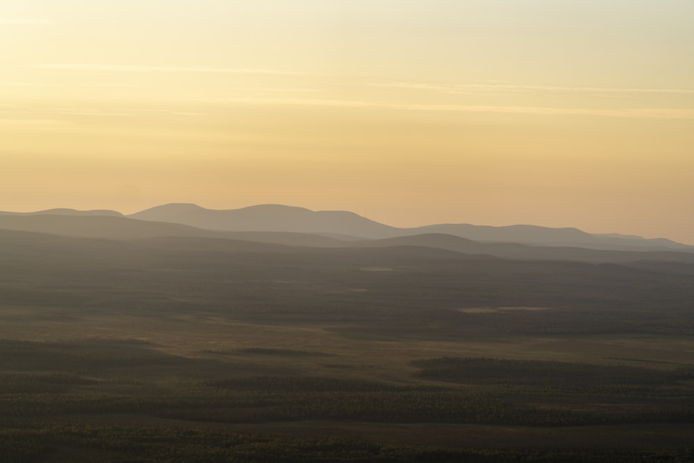 a view of a mountain range at sunset