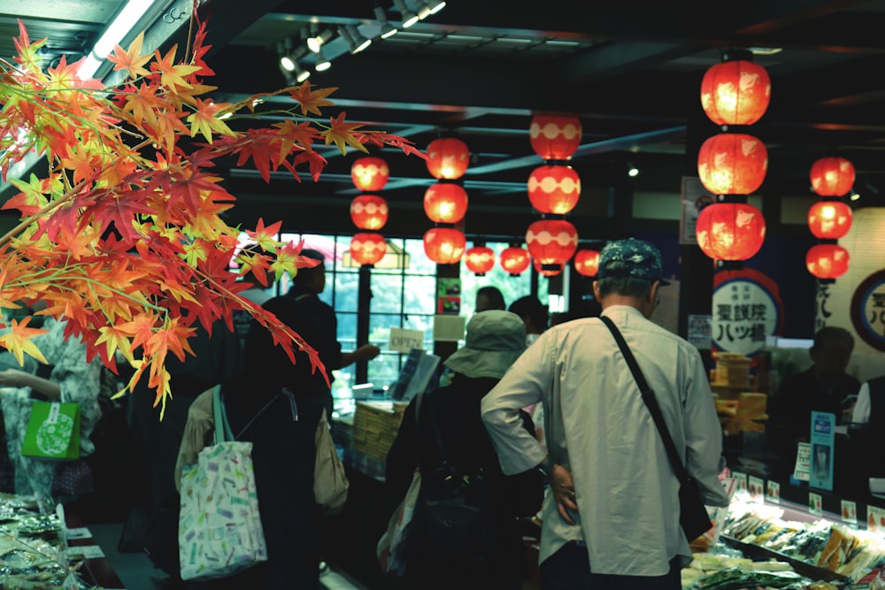 a group of people standing around a store