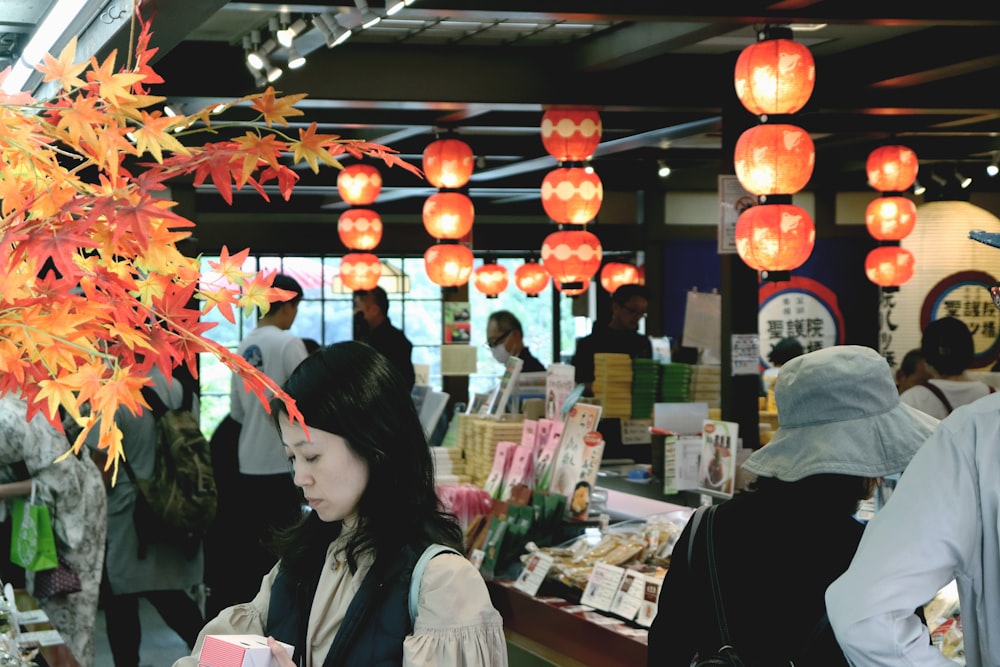 a group of people standing around a store