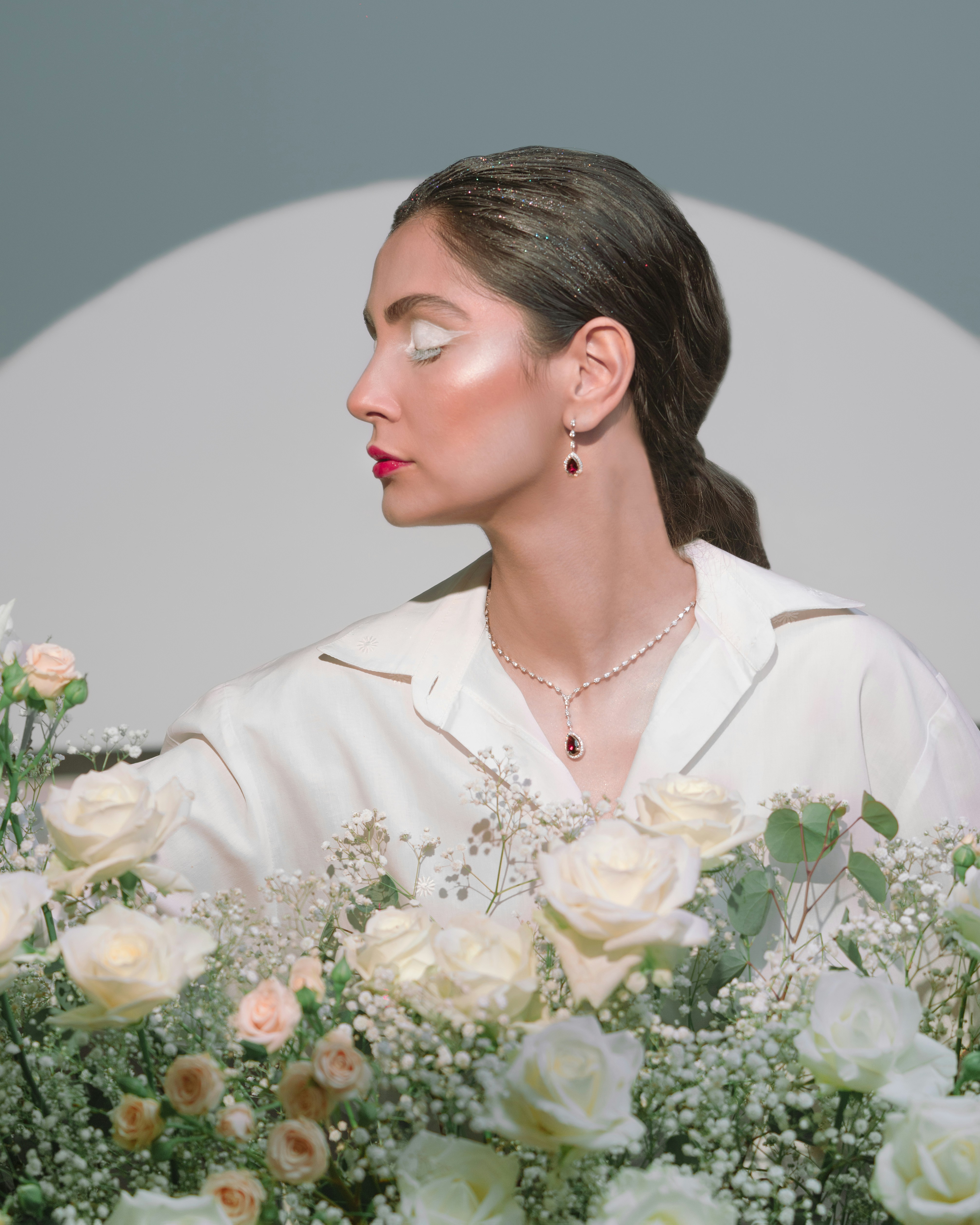 a woman with a bouquet of flowers in front of her