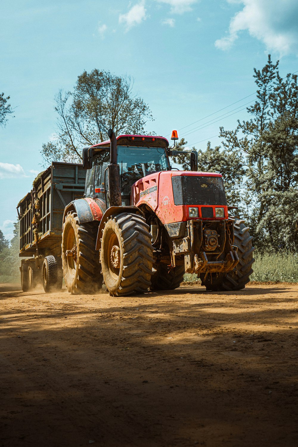 a large truck driving down a dirt road