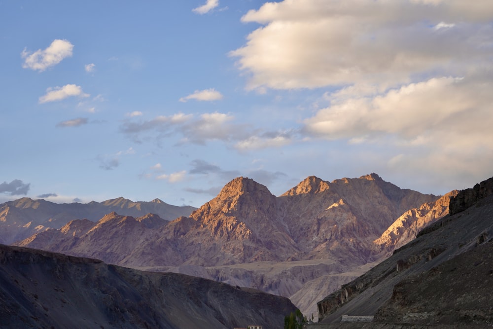 a view of a mountain range with a sky background