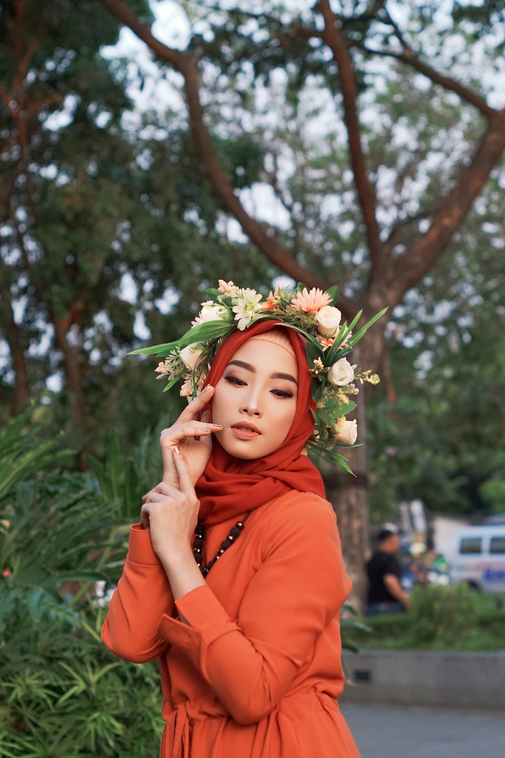 a woman with a flower crown on her head