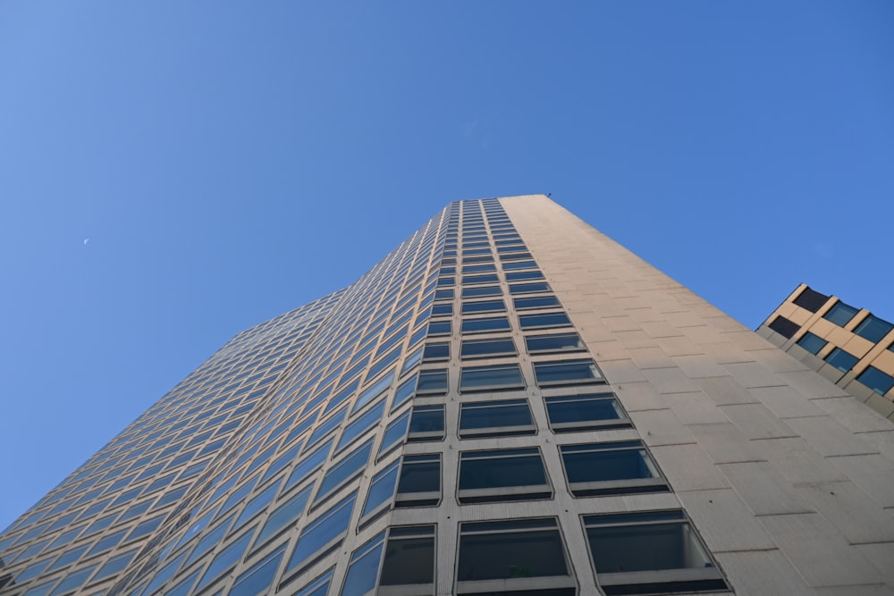 a very tall building with a sky background