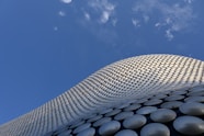 a tall building with a sky background