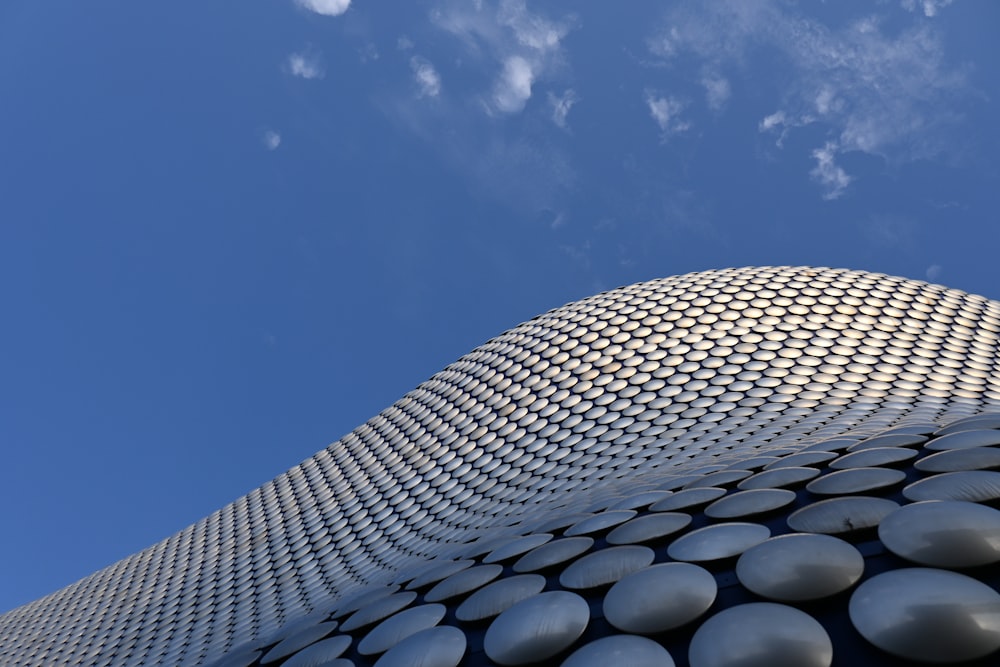 a tall building with a sky background