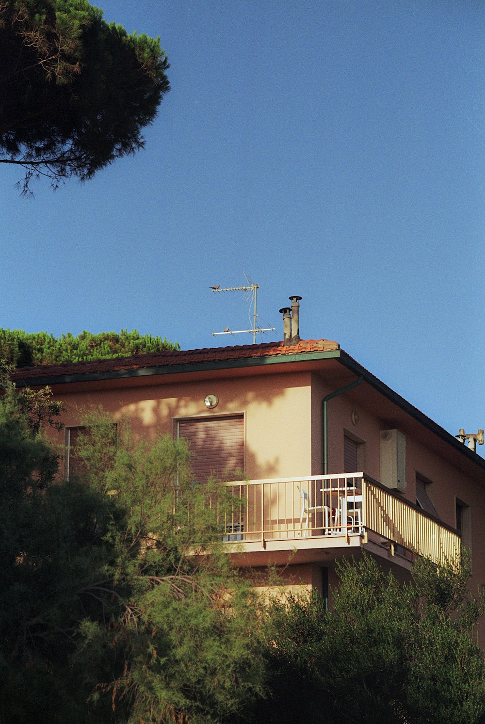 a house on a hill with a balcony