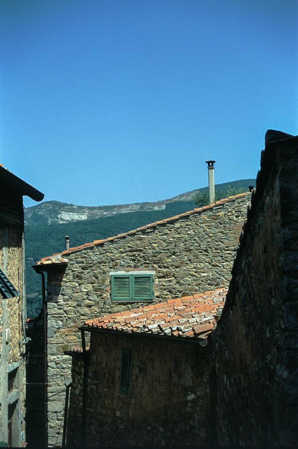 a stone building with a clock tower on top of it