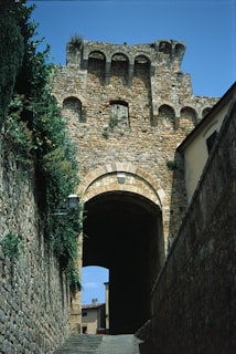 a stone building with a stone walkway leading to it