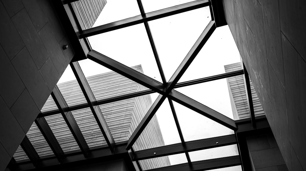 a black and white photo looking up at a building