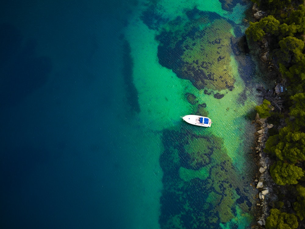 an aerial view of a boat in the water