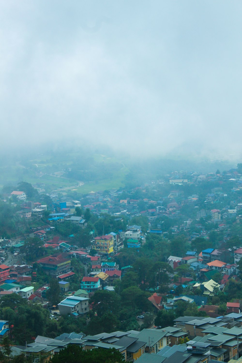 a view of a city from a hill