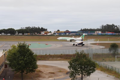 A busy airport runway with airplanes taking off and landing.