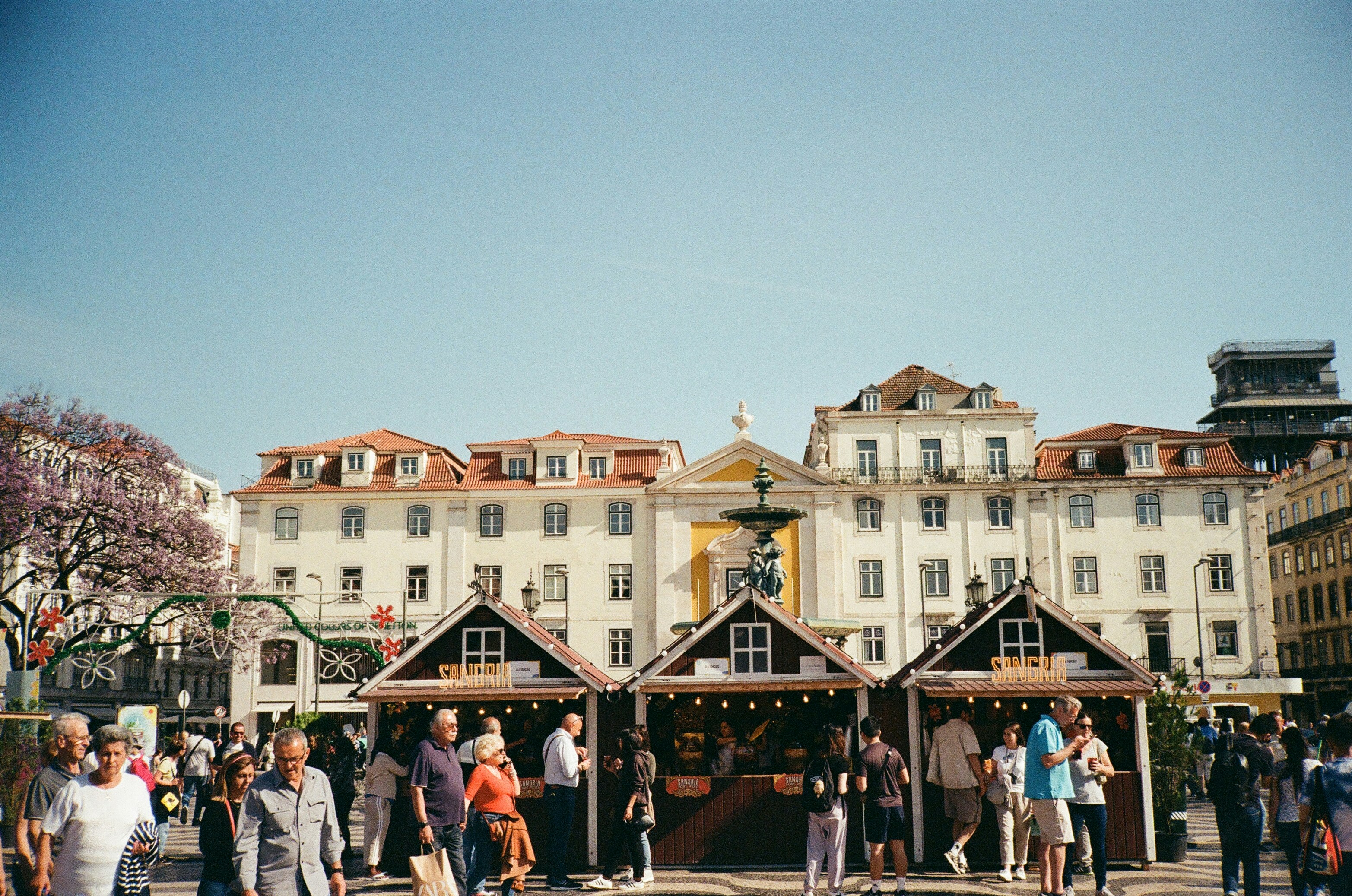a group of people standing in front of a building