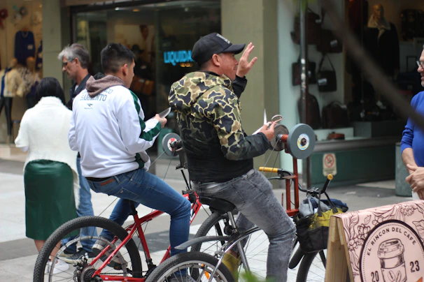 Happy riders gathered around the Torrejón Bike Shop mobile service van, getting their bikes tuned