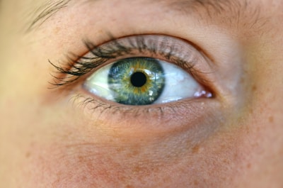 a close up of a person's blue eye
