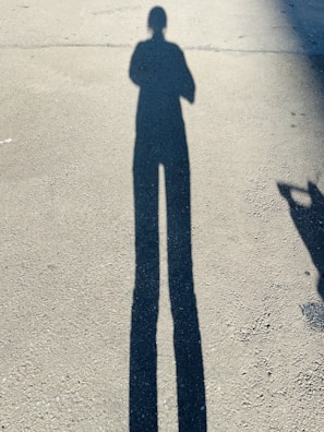 Early morning light casting long shadows over the foundation being poured.