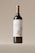 A wine bottle with a sleek and elegant design is centered against a neutral background. The label features an illustration of an owl, adding a touch of artistic charm, and prominently displays the text 'An Elegant Wine.' The bottle has a dark body with a shiny metallic gold cap.
