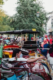 a group of people riding on top of a cart