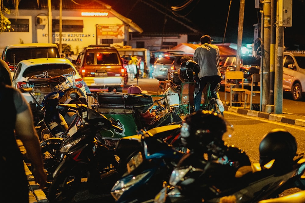 a group of motorcycles parked on the side of a road