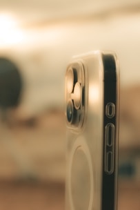 a close up of a cell phone with a blurry background