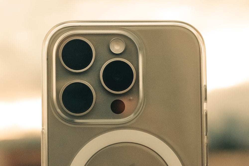 a close up of an iphone with a speaker