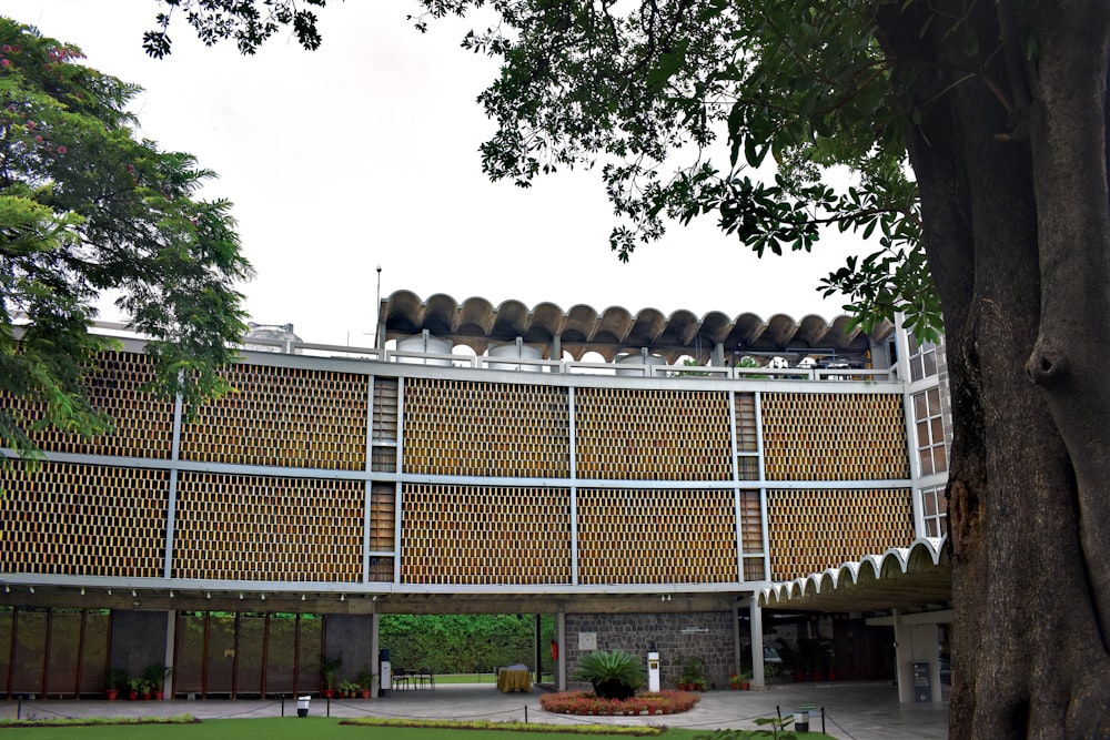 a large building with a tree in front of it