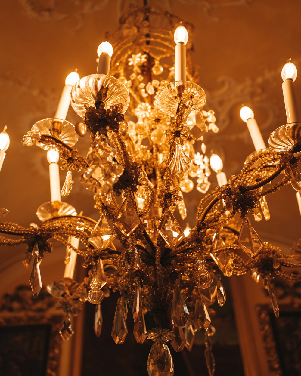 a chandelier hanging from a ceiling in a room