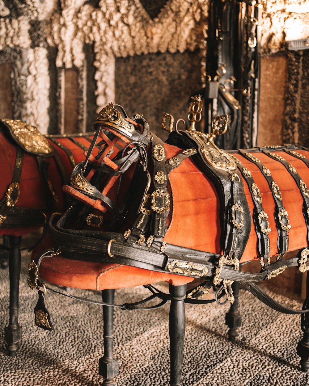 a close up of a horse drawn carriage on a carpet