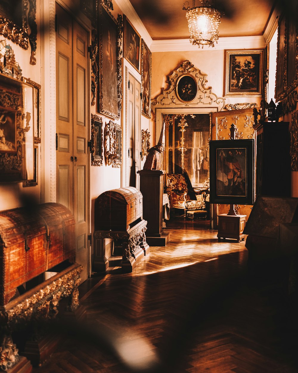 a living room with a fireplace and lots of pictures on the wall