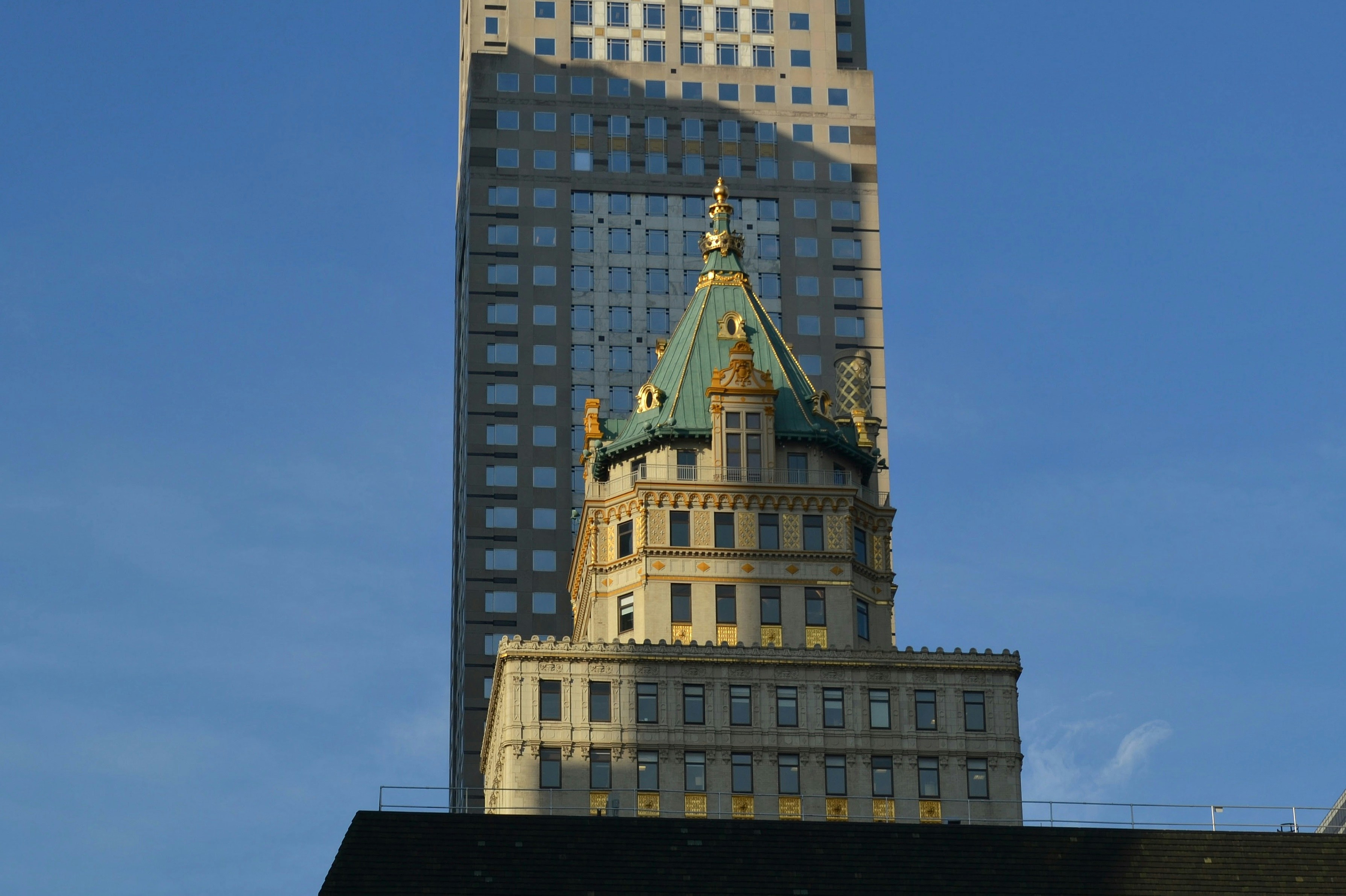 a very tall building with a clock on it's side