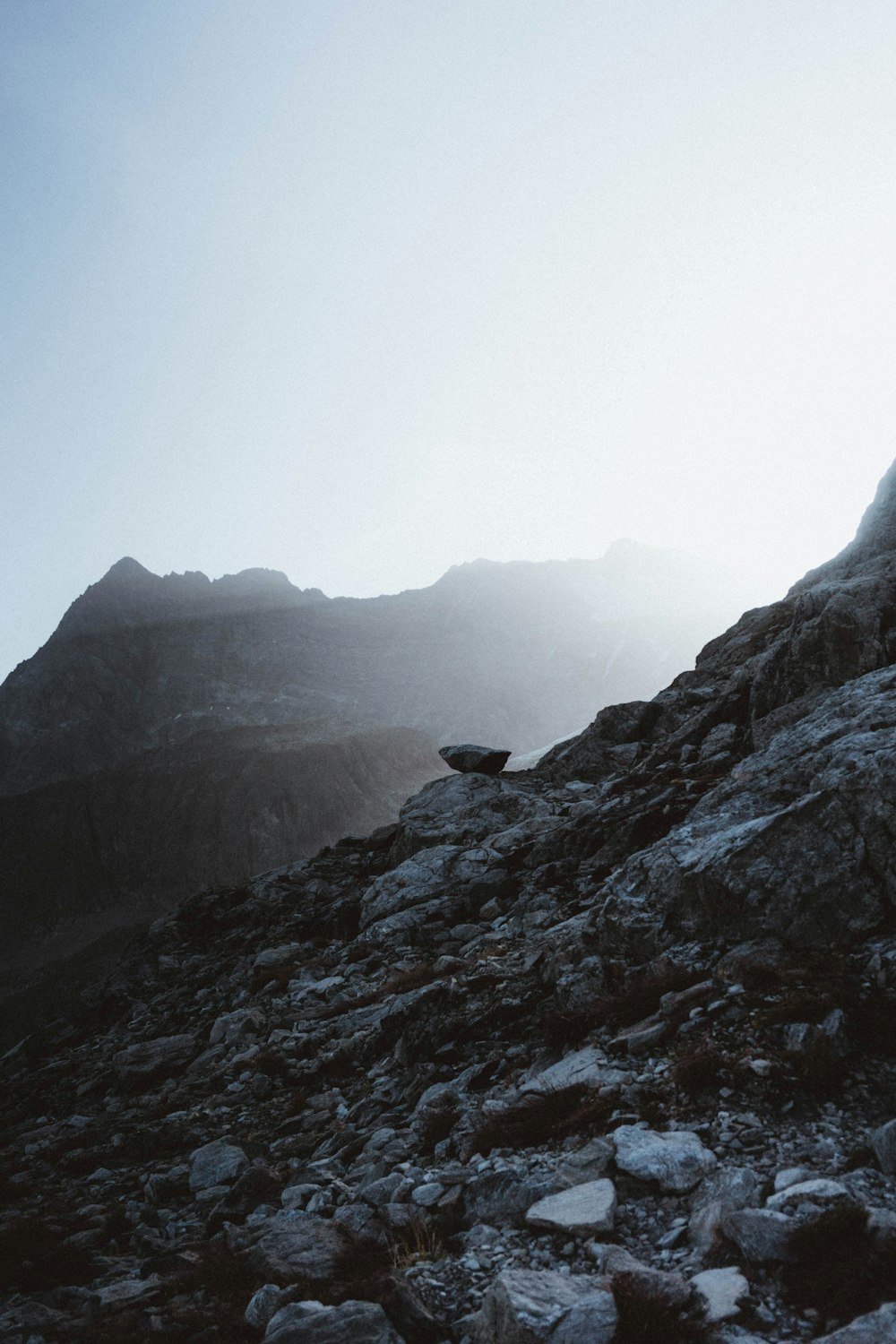 a person climbing up a rocky mountain side