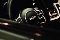 Close-up of a Volvo car's elegant leather interior with ambient lighting.