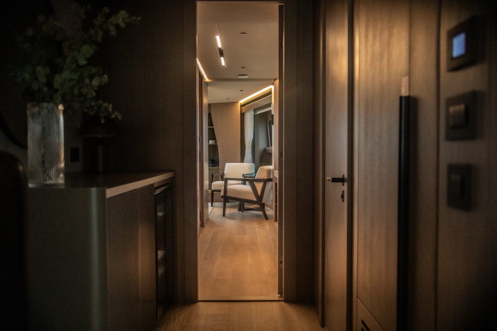 a hallway leading to a living room and dining room