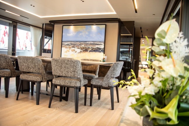 Elegant wooden dining table set in a modern living room.