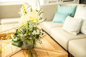 A bright, modern living room featuring a sleek beige coffee table from Meublizah.