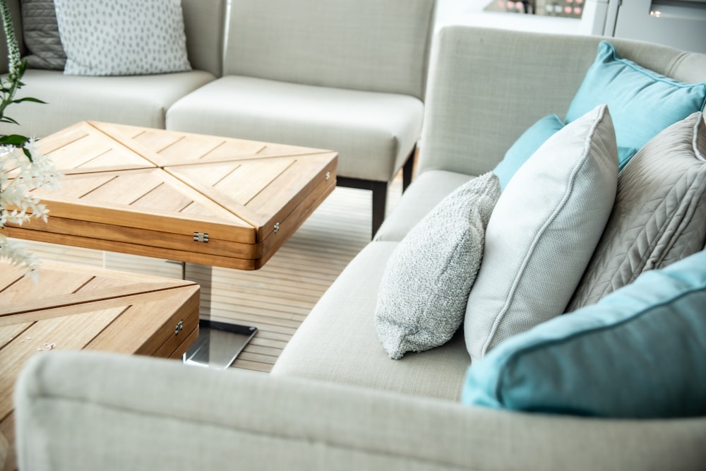 a living room filled with furniture and pillows