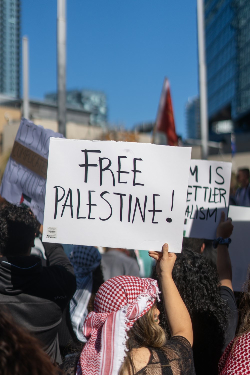 a group of people holding up signs in the air